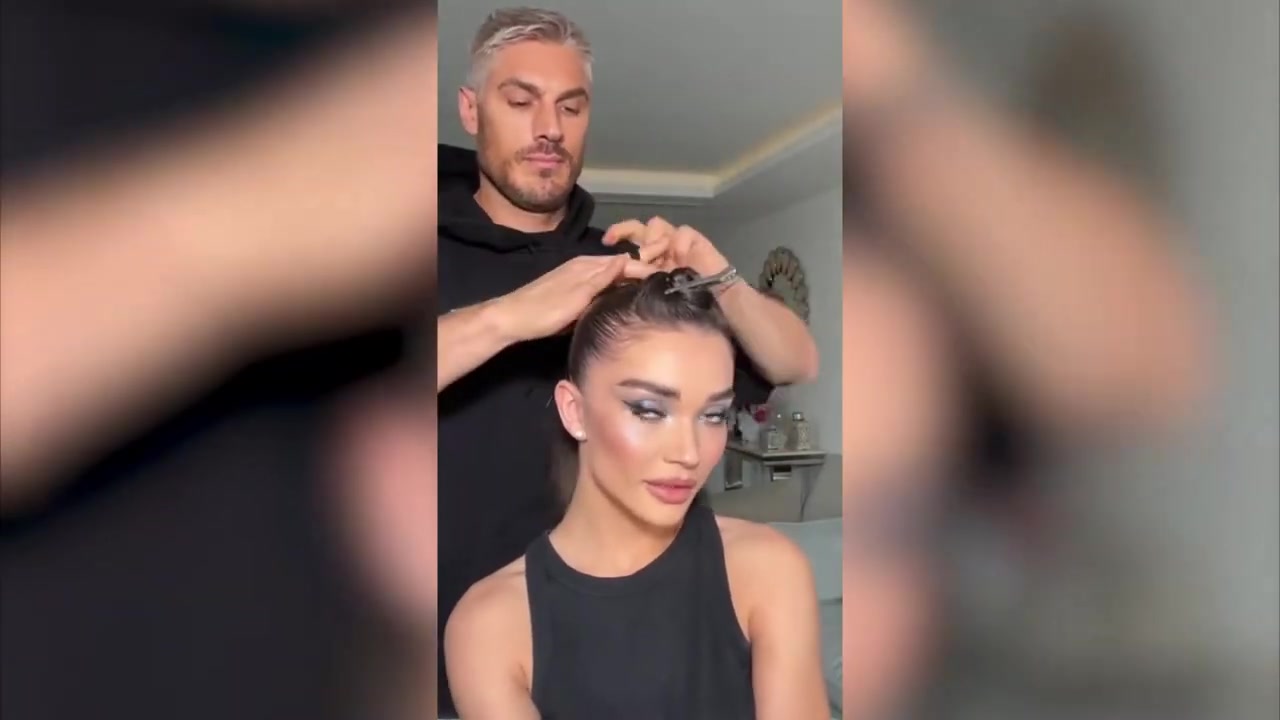 Chris Appleton demonstrating smooth the roots and make a ponytail