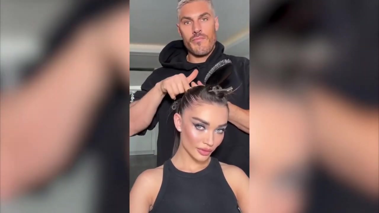 Chris Appleton demonstrating smooth the roots and make a ponytail