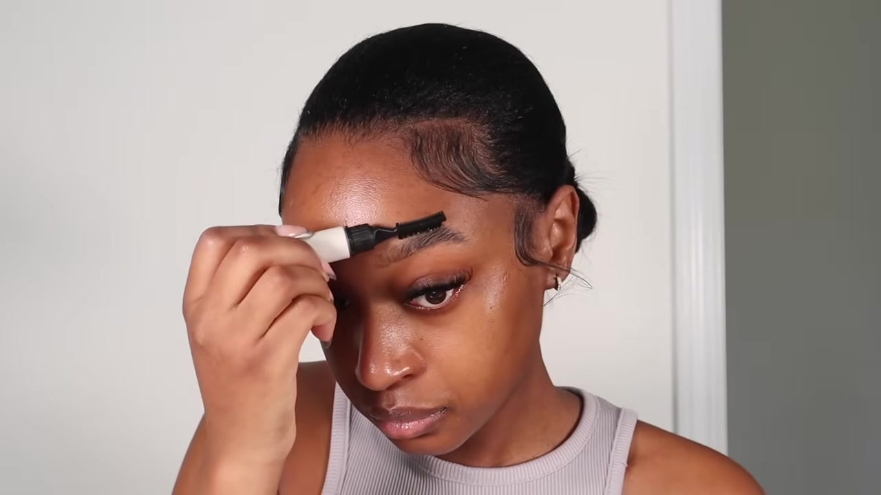 Fatima Bah demonstrating fill, brush and shape the brows