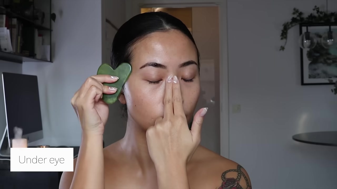 Tina Engeo demonstrating use a lighter touch under the eyes