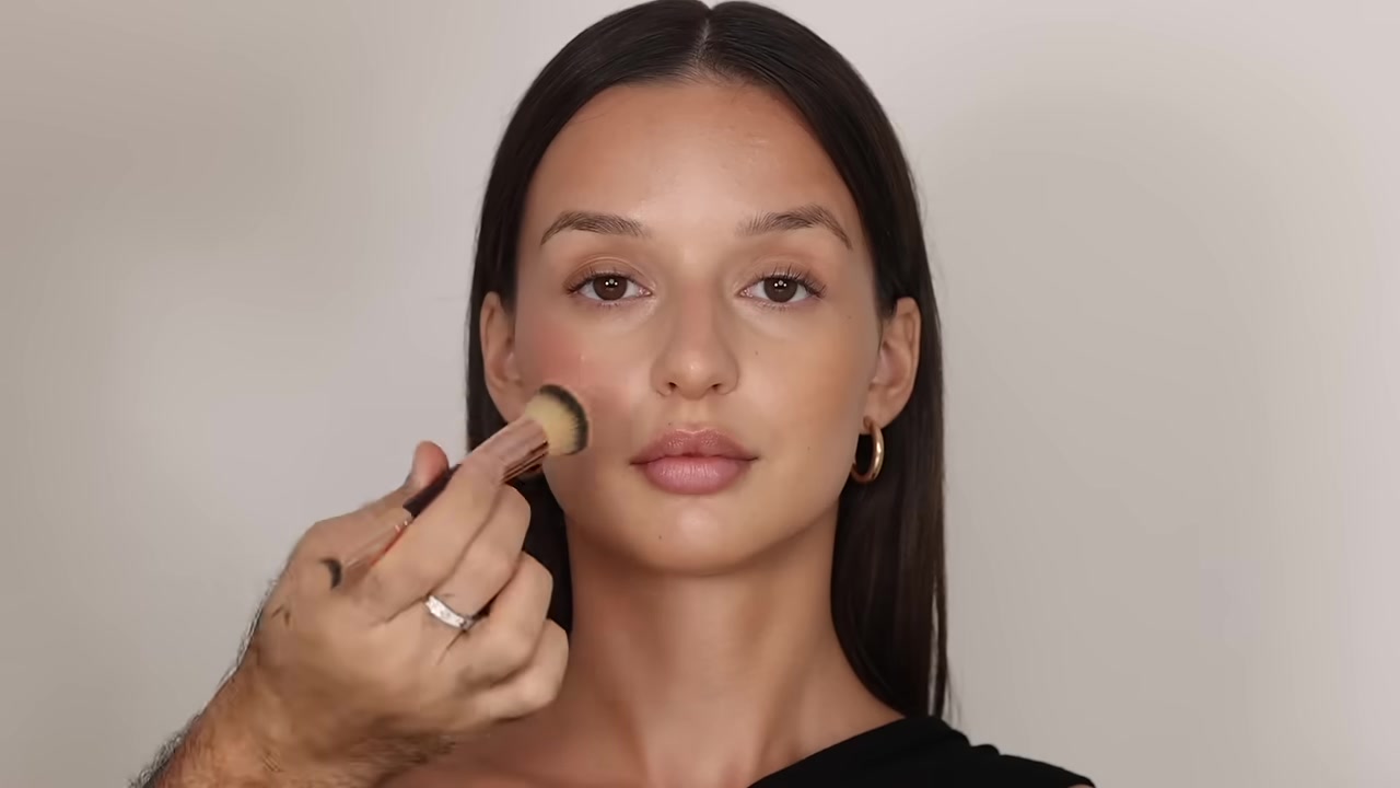 Hindash demonstrating tap glowing blush over the cheekbones