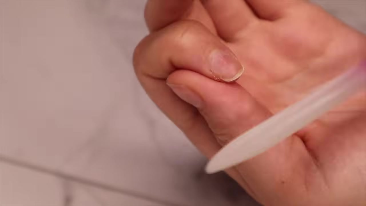 kayli boyle demonstrating smooth the free edge with a file