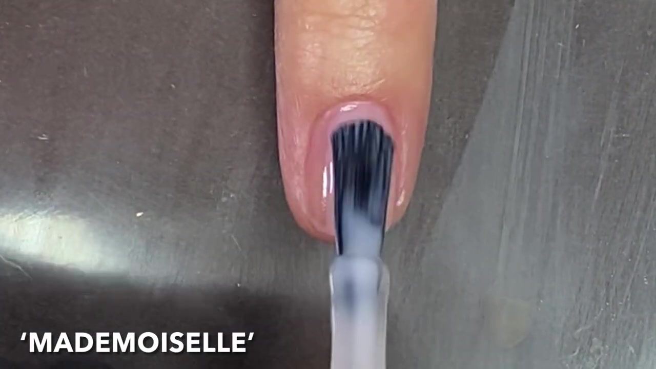 Simple Nail Designs demonstrating apply the sheer pink polish