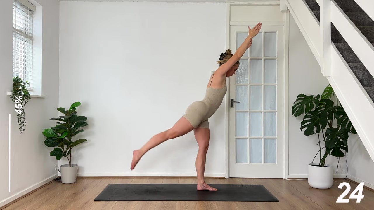 MonikaFit demonstrating overhead reach and kickback, right leg