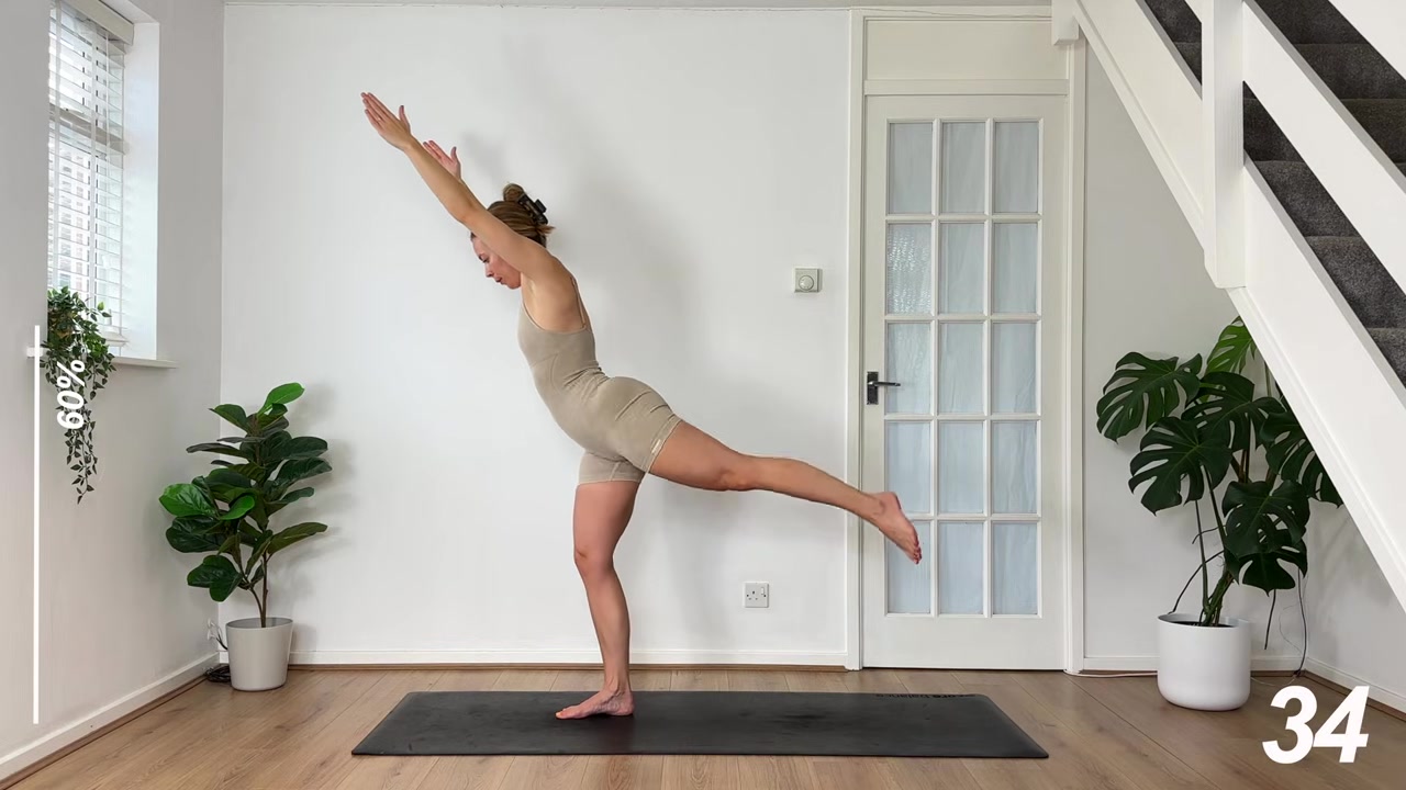 MonikaFit demonstrating overhead reach and kickback, left leg