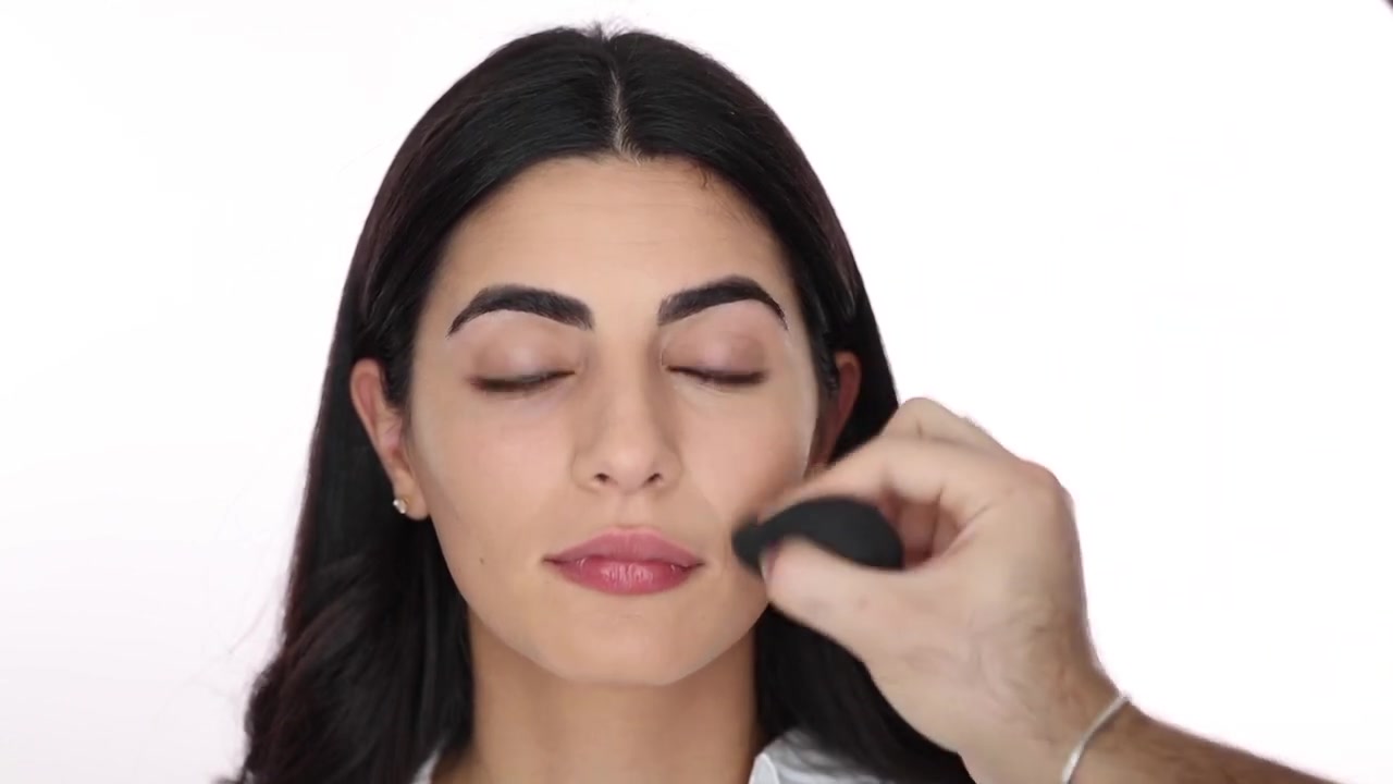 Hindash demonstrating press concealer into targeted areas