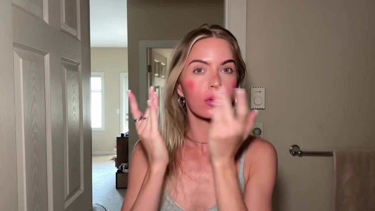 Holly Ward demonstrating build pink cheeks and add highlight