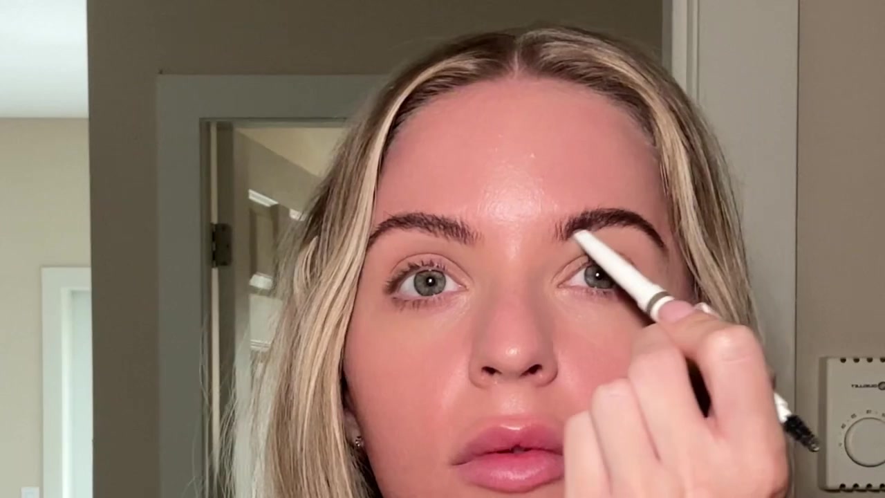 Holly Ward demonstrating brush up and define your brows