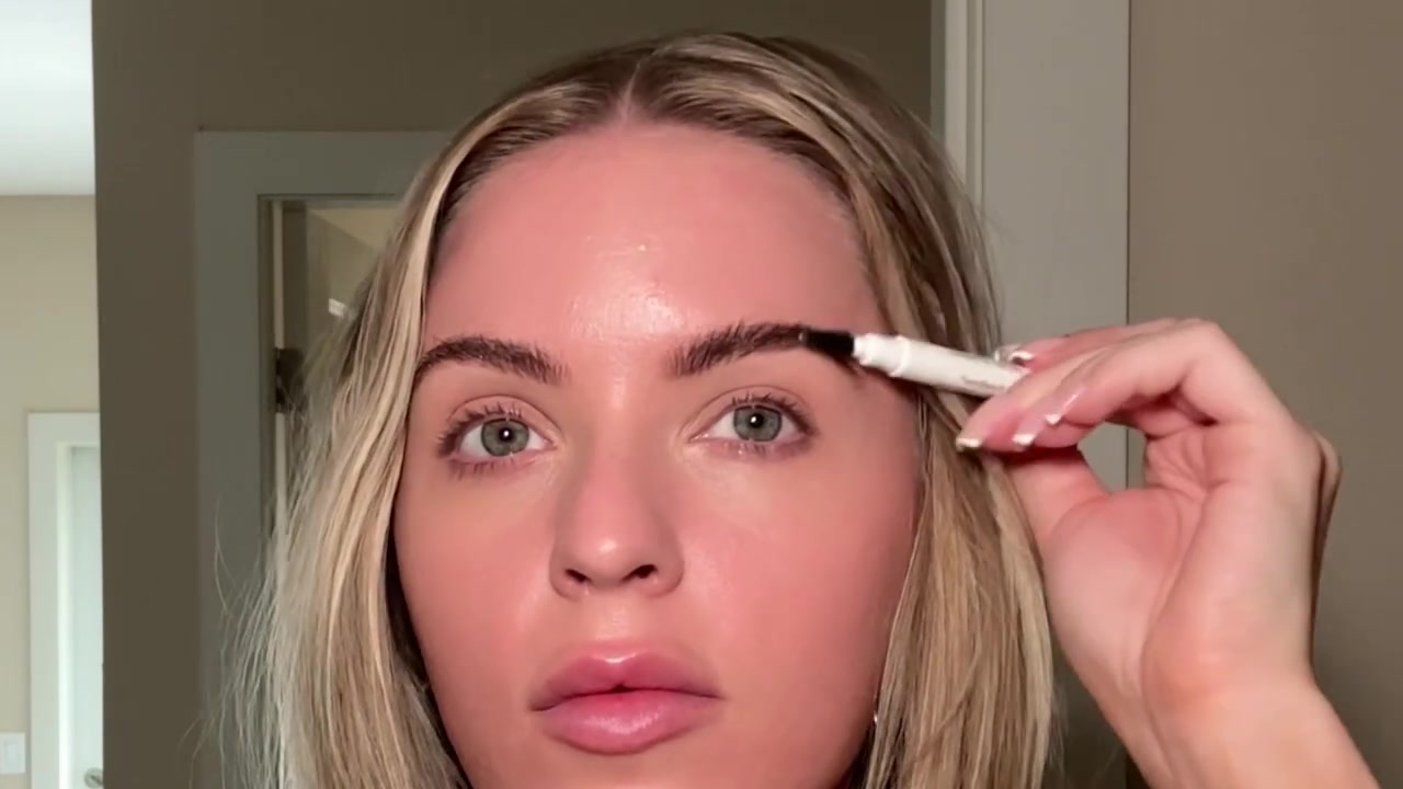 Holly Ward demonstrating brush up and define your brows